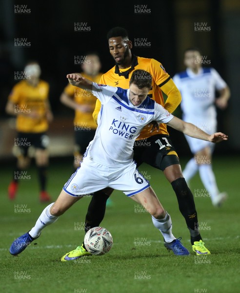 060119 - Newport County v Leicester City, FA Cup Third Round - Jonny Evans of Leicester City holds off Jamille Matt of Newport County