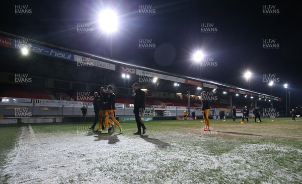 210120 - Newport County v Leicester City U21s, EFL Leasingcom Trophy Quarter-Final - Newport County players leave the pitch during warm up as it announced that the match is postponed due to a frozen pitch just 20 minutes before it was due to start