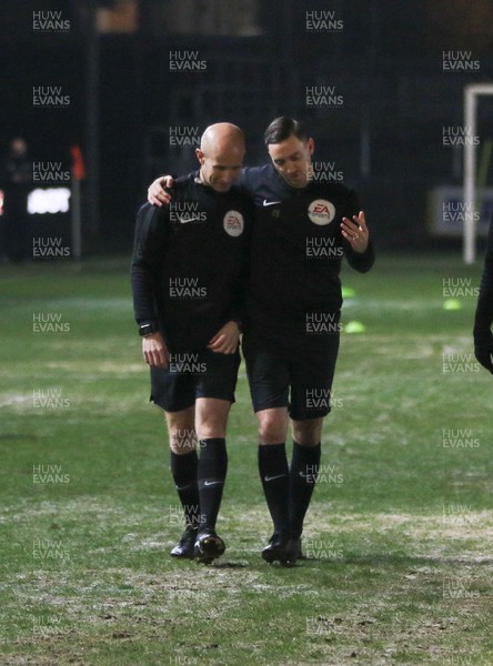 210120 - Newport County v Leicester City U21s, EFL Leasingcom Trophy Quarter-Final - The match officials converse as it announced that the match is postponed due to a frozen pitch just 20 minutes before it was due to start