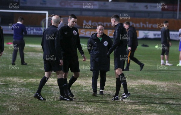 210120 - Newport County v Leicester City U21s, EFL Leasingcom Trophy Quarter-Final - The match officials converse as it announced that the match is postponed due to a frozen pitch just 20 minutes before it was due to start