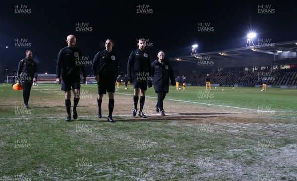 210120 - Newport County v Leicester City U21s, EFL Leasingcom Trophy Quarter-Final - Match officials leave the pitch during warm up as it announced that the match is postponed due to a frozen pitch just 20 minutes before it was due to start