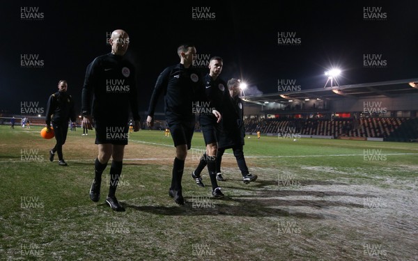 210120 - Newport County v Leicester City U21s, EFL Leasingcom Trophy Quarter-Final - Match officials leave the pitch during warm up as it announced that the match is postponed due to a frozen pitch just 20 minutes before it was due to start