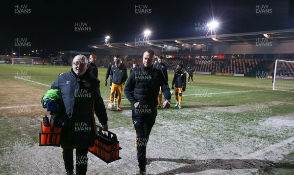 210120 - Newport County v Leicester City U21s, EFL Leasingcom Trophy Quarter-Final - Newport County manager Michael Flynn, centre, leaves the pitch as it announced that the match is postponed due to a frozen pitch just 20 minutes before it was due to start