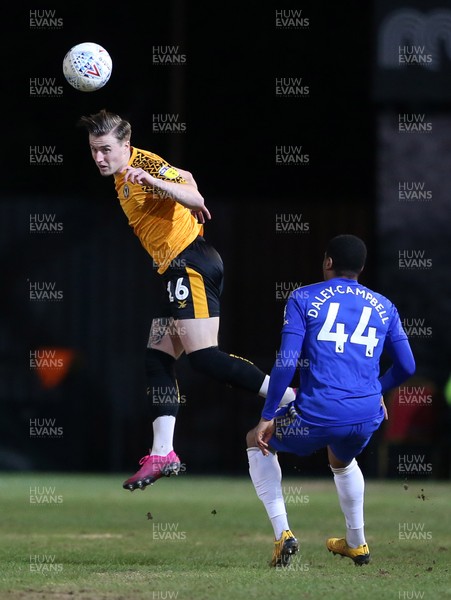 040220 - Newport County v Leicester City U21s - Leasingcom Trophy - George Nurse of Newport County headers the ball away from Vontae Daley-Campbell of Leicester City U21s