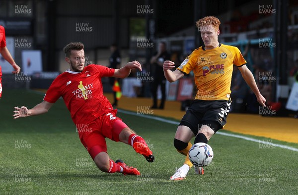 040921 - Newport County v Leyton Orient - SkyBet League Two - Ryan Haynes of Newport County is tackled by Tom James of Leyton Orient