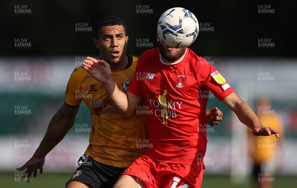 040921 - Newport County v Leyton Orient - SkyBet League Two - Aaron Drinan of Leyton Orient is challenged by Priestley Farquharson of Newport County