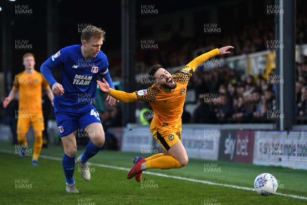 291219 - Newport County v Leyton Orient - SkyBet League 2 - Josh Sheehan of Newport County is tackled by Josh Wright of Leyton Orient