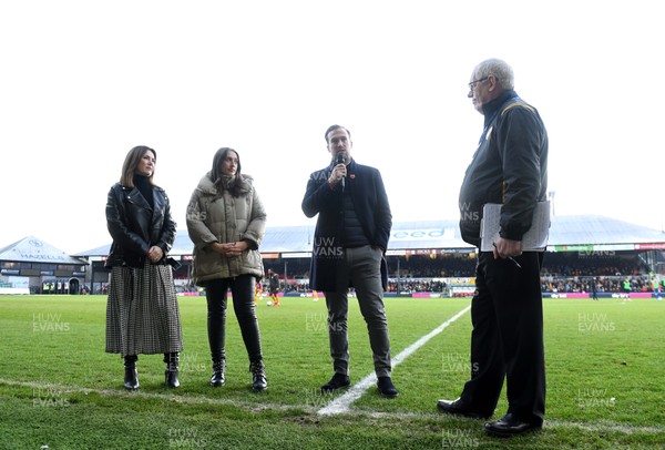 291219 - Newport County v Leyton Orient - SkyBet League 2 - Family of Justin Edinburgh (L-R) wife Kerri, Daughter Cydney and son Charlie during a half time presentation to induct Justin into the Newport County Hall of Fame