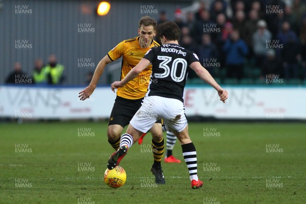 231217 - Newport County v Lincoln City - Sky Bet League 2 - Mickey Demetriou of Newport County closes down Alex Woodyard of Lincoln City