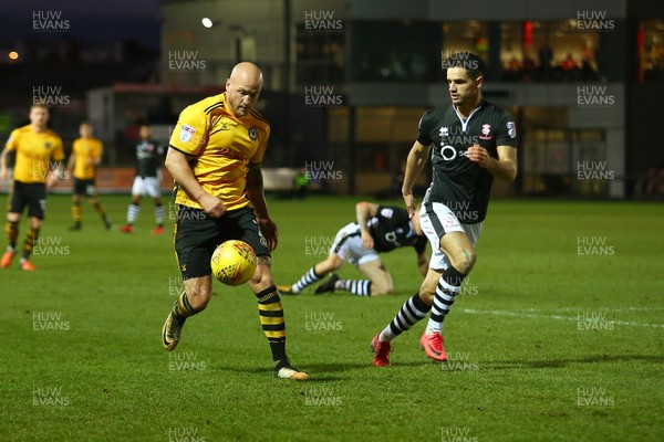 231217 - Newport County v Lincoln City - Sky Bet League 2 - David Pipe of Newport County takes on Sam Habergham of Lincoln City