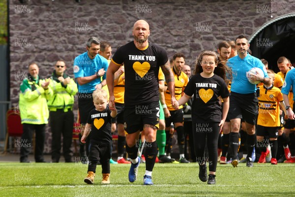 270419 Newport County v Lincoln City - Sky Bet League 2 - David Pipe of Newport County leads out the team following his announcement to retire 