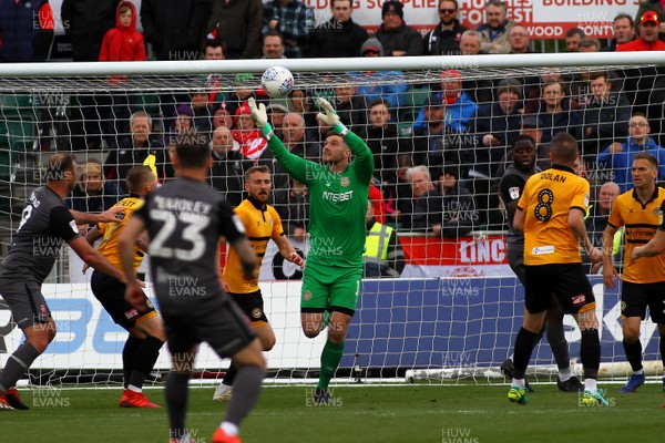 270419 Newport County v Lincoln City - Sky Bet League 2 - Joe Day of Newport County takes control of a high ball