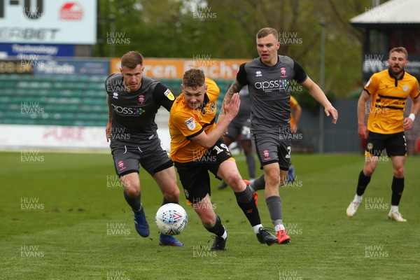 270419 Newport County v Lincoln City - Sky Bet League 2 - Ben Kennedy of Newport County beats Michael O Connor(L) and Harry Anderson of Lincoln City 