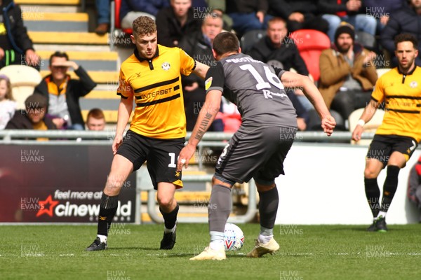 270419 Newport County v Lincoln City - Sky Bet League 2 - Ben Kennedy of Newport County takes on Michael Bostwick of Lincoln City 