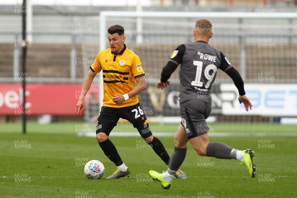 270419 Newport County v Lincoln City - Sky Bet League 2 - Regan Poole of Newport County takes on Danny Rowe of Lincoln City  