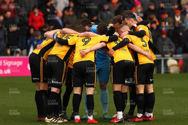 170318 - Newport County v Luton Town - Sky Bet League 2 - Players of Newport County huddle before kick off
