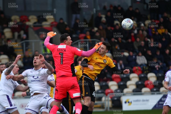 170318 - Newport County v Luton Town - Sky Bet League 2 - Aaron Collins of Newport County is beaten in the air by Marek Stech of Luton Town 