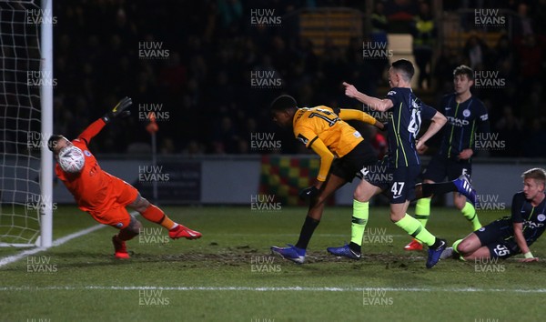 160219 - Newport County v Manchester City - FA Cup 5th Round - Tyreeq Bakinson of Newport County has his header saved by Keeper Ederson of Manchester City