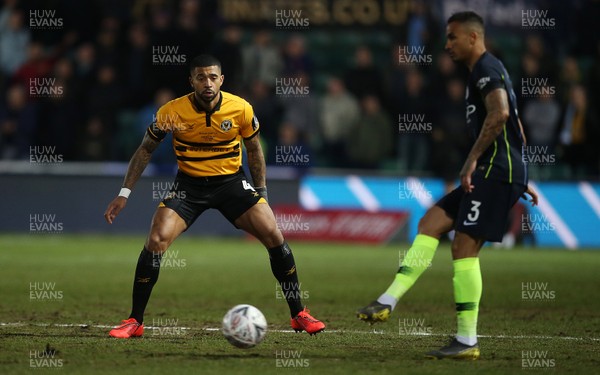 160219 - Newport County v Manchester City - FA Cup 5th Round - Joss Labadie of Newport County watches Danilo of Manchester City