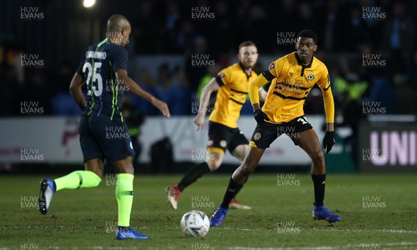 160219 - Newport County v Manchester City - FA Cup 5th Round - Fernandinho of Manchester City is challenged by Tyreeq Bakinson of Newport County