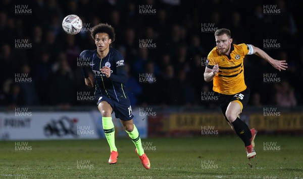 160219 - Newport County v Manchester City - FA Cup 5th Round - Leroy Sane of Manchester City is challenged by Mark O'Brien of Newport County