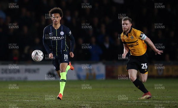 160219 - Newport County v Manchester City - FA Cup 5th Round - Leroy Sane of Manchester City is challenged by Mark O'Brien of Newport County