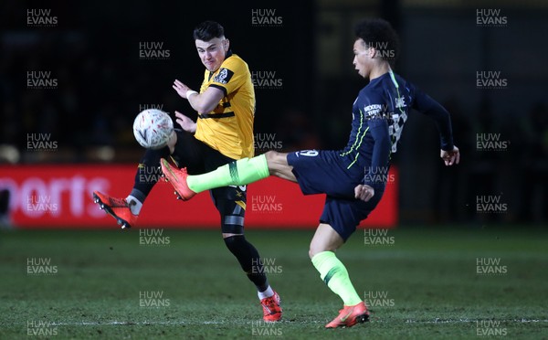 160219 - Newport County v Manchester City - FA Cup 5th Round - Leroy Sane of Manchester City is challenged by Regan Poole of Newport County