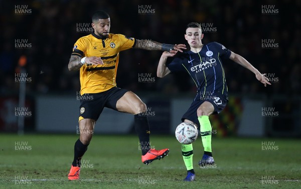 160219 - Newport County v Manchester City - FA Cup 5th Round - Joss Labadie of Newport County is challenged by Phil Foden of Manchester City