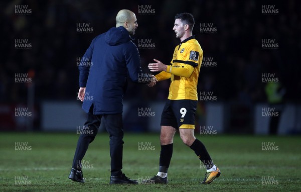 160219 - Newport County v Manchester City - FA Cup 5th Round - Padraig Amond of Newport County shakes hands with Manchester City Manager Pep Guardiola at full time