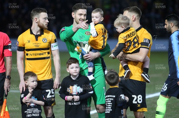 160219 - Newport County v Manchester City - FA Cup 5th Round - Joe Day of Newport County with his son
