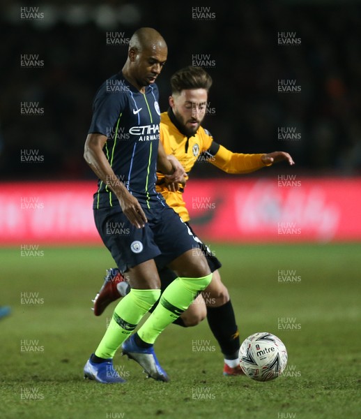 160219 - Newport County v Manchester City, FA Cup Fifth Round - Josh Sheehan of Newport County challenges Fernandinho of Manchester City