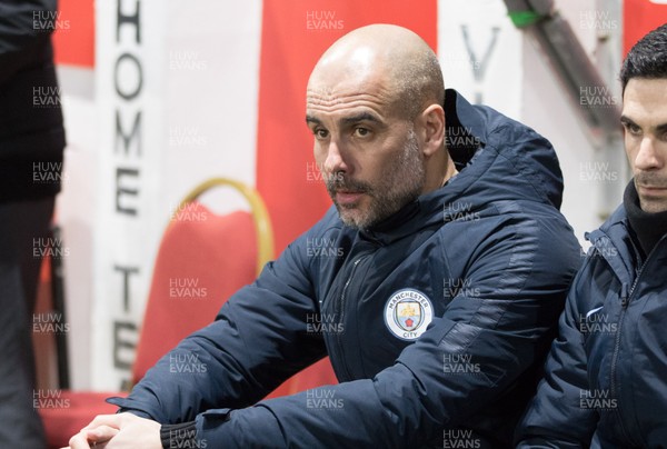 160219 - Newport County v Manchester City, FA Cup Fifth Round - Manchester City manager Pep Guardiola in the dugout