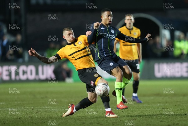 160219 - Newport County v Manchester City, FA Cup Fifth Round - Scot Bennett of Newport County challenges Gabriel Jesus of Manchester City