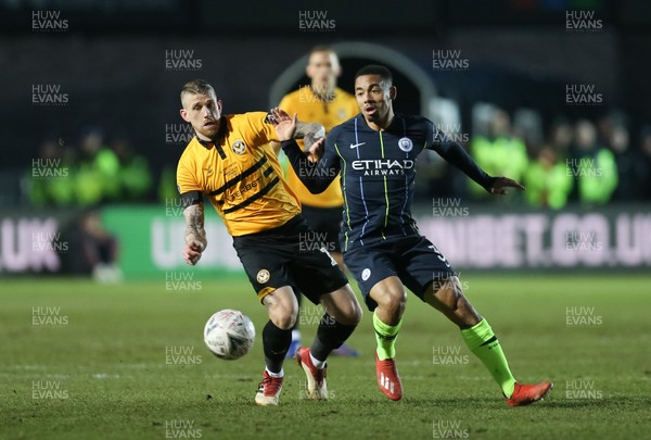 160219 - Newport County v Manchester City, FA Cup Fifth Round - Scot Bennett of Newport County challenges Gabriel Jesus of Manchester City