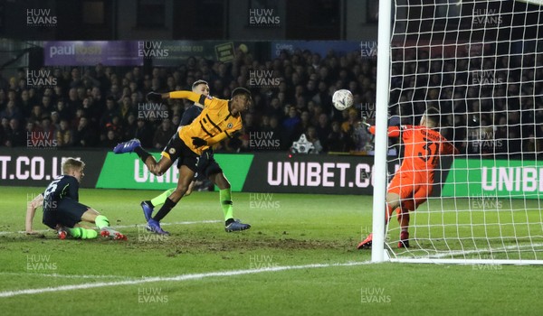 160219 - Newport County v Manchester City, FA Cup Fifth Round - Tyreeq Bakinson of Newport County goes close as he heads at Manchester City goalkeeper Ederson