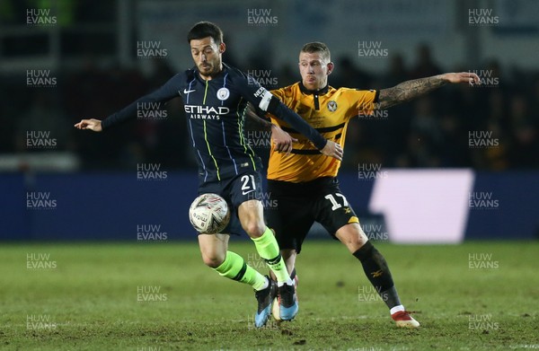160219 - Newport County v Manchester City, FA Cup Fifth Round - David Silva of Manchester City holds off Scot Bennett of Newport County
