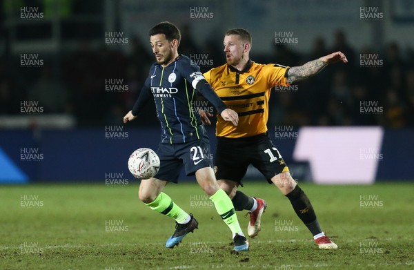 160219 - Newport County v Manchester City, FA Cup Fifth Round - David Silva of Manchester City holds off Scot Bennett of Newport County