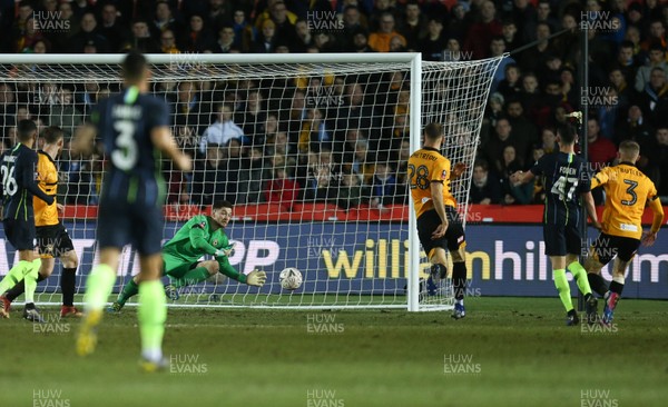 160219 - Newport County v Manchester City, FA Cup Fifth Round - Phil Foden of Manchester City shoots to score the second goal