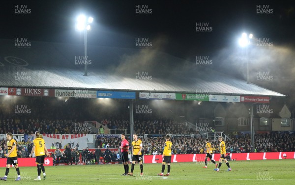 160219 - Newport County v Manchester City, FA Cup Fifth Round - Smoke from a flare drifts from the stand during the second half