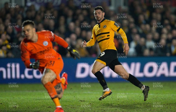 160219 - Newport County v Manchester City, FA Cup Fifth Round - Padraig Amond of Newport County looks on as he beats Manchester City goalkeeper Ederson to score goal