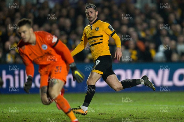 160219 - Newport County v Manchester City, FA Cup Fifth Round - Padraig Amond of Newport County looks on as he beats Manchester City goalkeeper Ederson to score goal