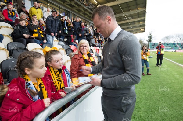 160219 - Newport County v Manchester City, FA Cup Fifth Round - Newport County manager Michael Flynn signs autographs prior to the start of the match