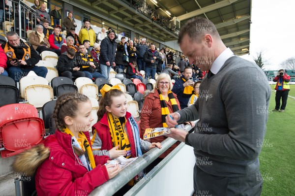 160219 - Newport County v Manchester City, FA Cup Fifth Round - Newport County manager Michael Flynn signs autographs prior to the start of the match