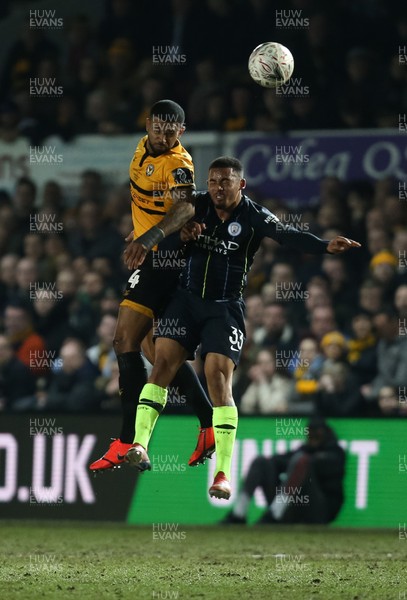 160219 - Newport County v Manchester City, FA Cup Fifth Round - Joss Labadie of Newport County beats Gabriel Jesus of Manchester City to head the ball