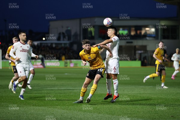 280124 - Newport County v Manchester United - FA Cup, Fourth Round - Seb Palmer-Houlden of Newport County is challenged by Lisandro Mart�nez of Manchester United 