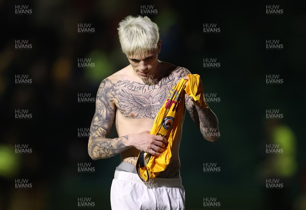 280124 - Newport County v Manchester United - FA Cup, Fourth Round - Alejandro Garnacho of Manchester United shows off his chest tattoos with a swapped Newport County shirt