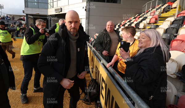 280124 - Newport County v Manchester United, FA Cup Fourth Round - Manchester United manager Erik ten Hag signs a shirt for a Newport County fan as he arrives at Rodney Parade ahead of the match