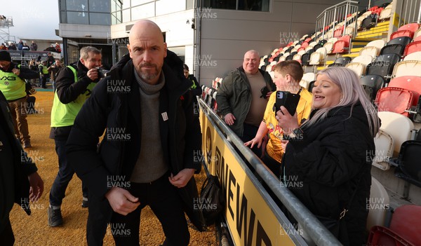 280124 - Newport County v Manchester United, FA Cup Fourth Round - Manchester United manager Erik ten Hag signs a shirt for a Newport County fan as he arrives at Rodney Parade ahead of the match