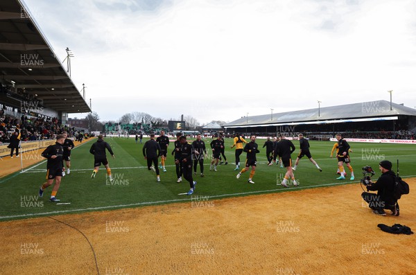 280124 - Newport County v Manchester United, FA Cup Fourth Round - Newport County players warm up ahead of the match