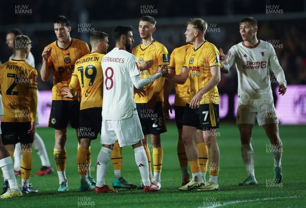 280124 - Newport County v Manchester United, FA Cup Fourth Round -Will Evans of Newport County with Bruno Fernandes of Manchester United at the end of the match